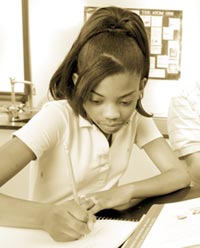 Photo of girl writing on notebook
